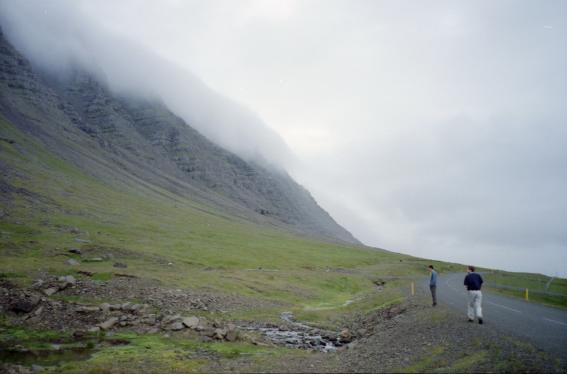 Gordon and Dave by the road viewing the mist-covered mountains