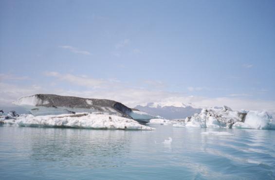 An iceberg covered in dirt - presumably dust, rock and ash