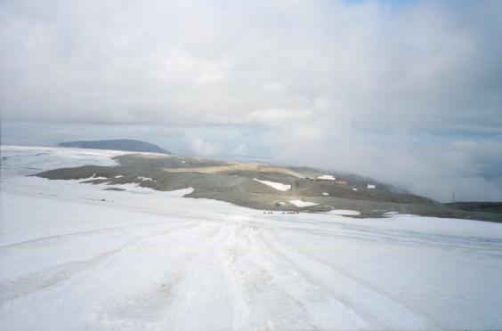 A view from on the glacier down to the station at the top of the mountain road